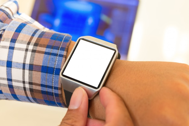 Smartwatch of businessman hands with with blank screen.