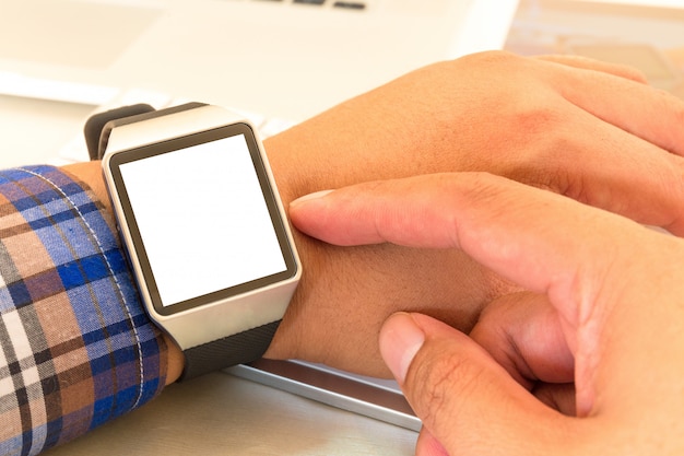 Smartwatch of businessman hands with with blank screen.