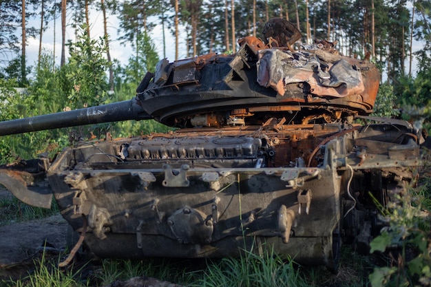 The smashed and burned modern tank of the russian army in ukraine in the war in