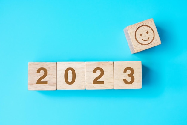 Smile face block with 2023 text on blue background Satisfaction feedback Review and New Year concepts