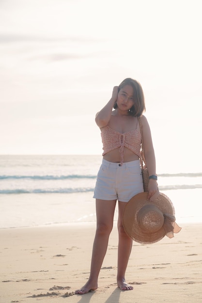 Smile Freedom and happiness asian woman on beach She is enjoying serene ocean nature during travel