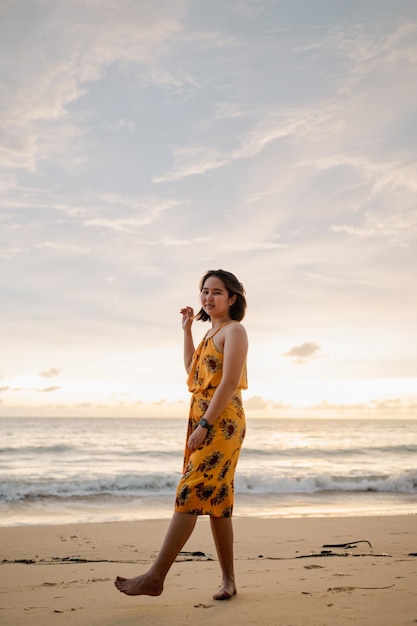 Smile Freedom and happiness asian woman on beach She is enjoying serene ocean nature during travel