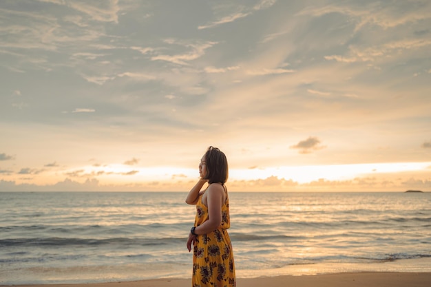 Smile Freedom and happiness asian woman on beach She is enjoying serene ocean nature during travel