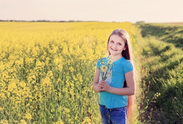 Smile girl in rape field