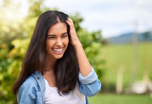 Smile is the best accessory a woman can wear Cropped shot of an attractive young woman standing outdoors