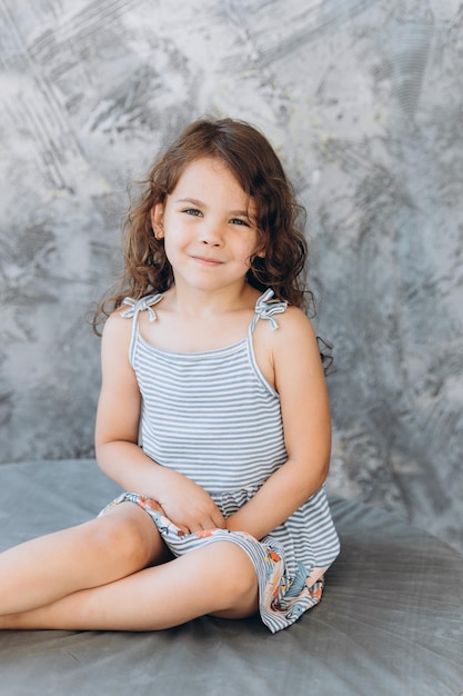 Smile little girl in studio