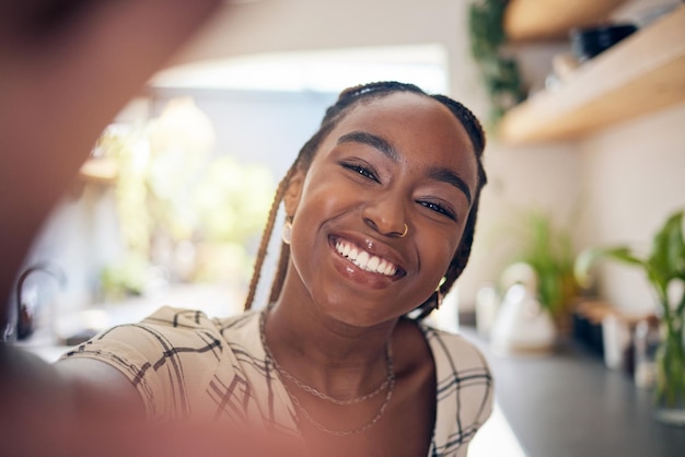 Smile selfie and face of a young black woman for social media happiness or positive attitude Portrait of African person with freedom motivation and confidence to relax at home for profile picture