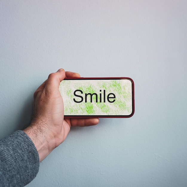 smile text on the smartphone, feeling and emotion