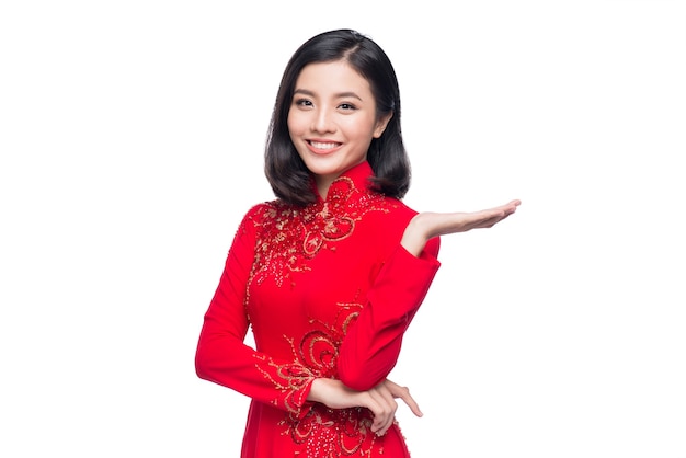 Smile Vietnamese woman in dress traditional Ao Dai and introduce on white background.