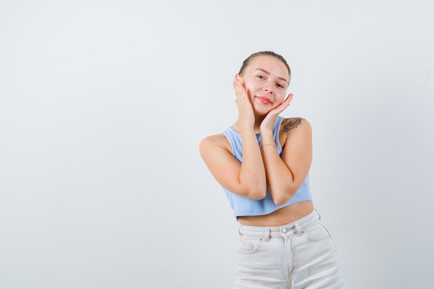 smiled girl is posing at camera on white background