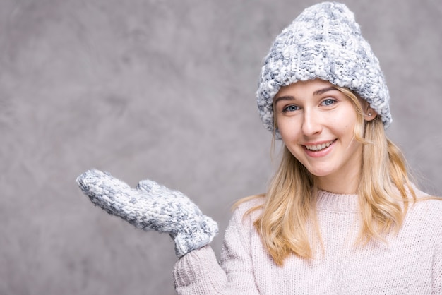 Smiley blonde woman with gloves