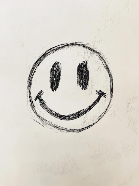 Photo smiley face drawn in chalk on a whiteboard positive emotions