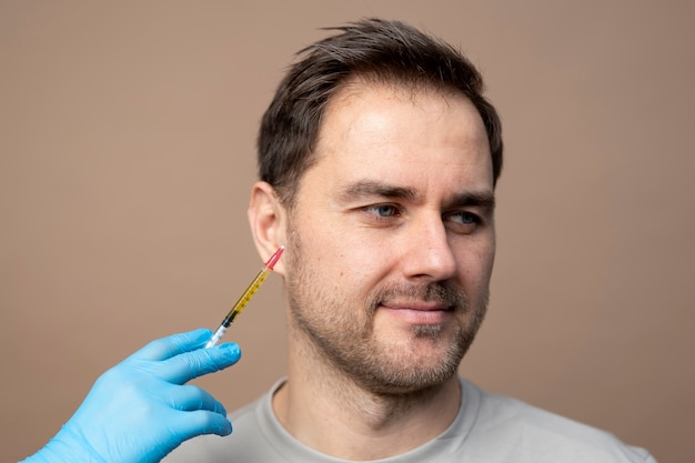 Smiley man getting injection