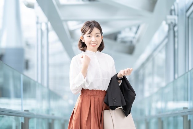 Smiley woman goes to working in business casual style