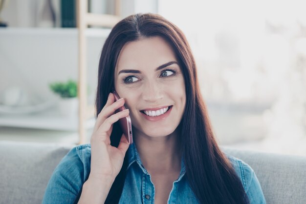 Smiley woman using smartphone