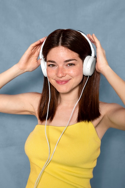 Smiley woman wearing headphones