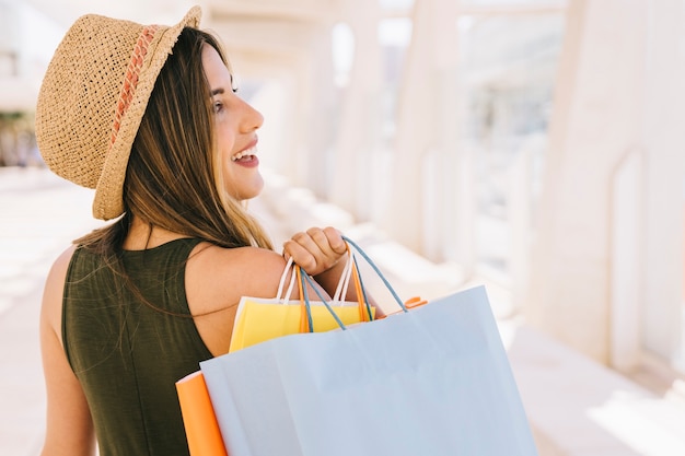 Smiley woman with shopping bags