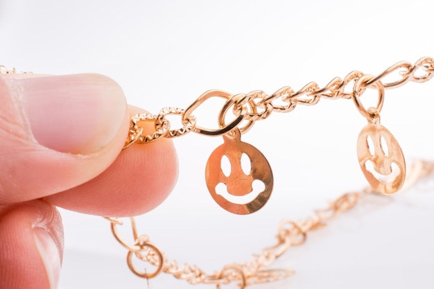 Smileys on a chain in hand