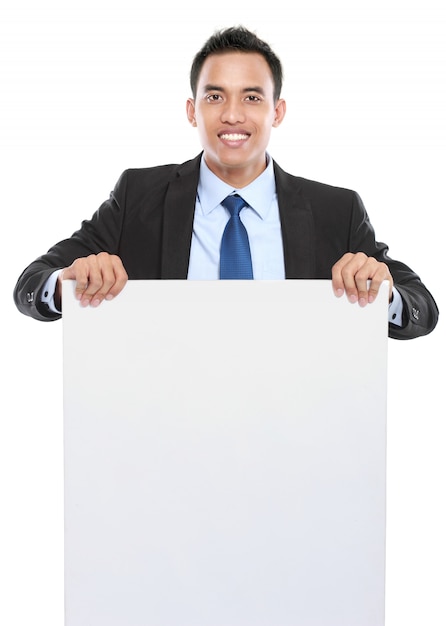 Smiling asian business man holding empty board