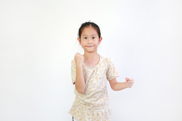 Smiling Asian little girl child showing expression hand holding something without theme on white