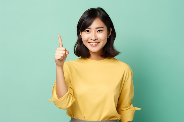 Smiling asian woman showing okay sign gives approval recommends smth good standing a colored backgro