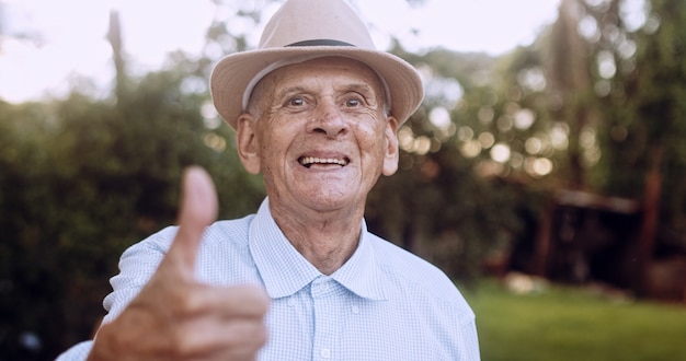 Smiling beautiful older male Latin farmer Elderly man at farm in summer day