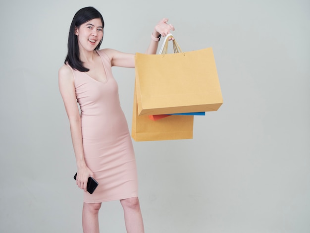 Smiling beauty woman with colorful shopping bags