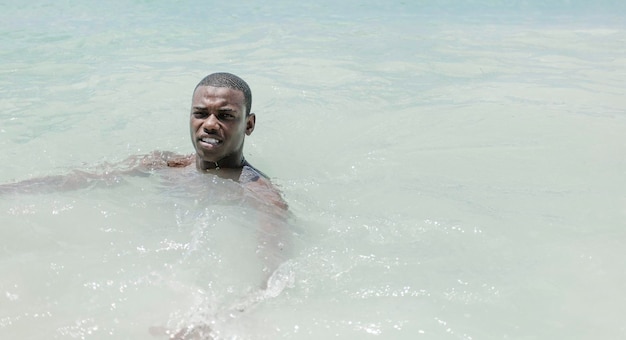 Smiling black man in the sea