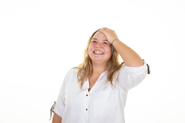 Smiling blonde happy oversize woman hand finger on hair in studio shot on white background