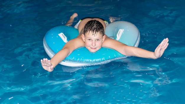 A smiling boy is bathing in the water Sports and recreation Healthy lifestyle