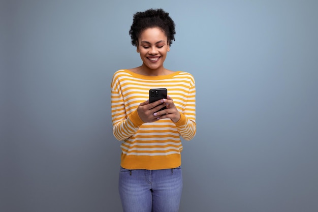 Smiling brunette brownhaired young woman with mobile phone