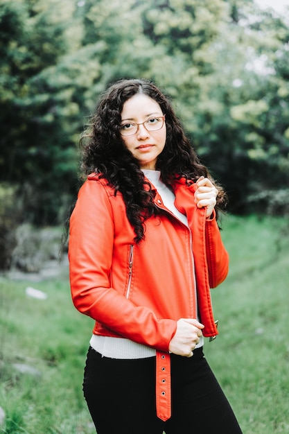 smiling, brunette, woman, red, leather, jacket, laughing, chilly, scenery, green, grass, outside, na