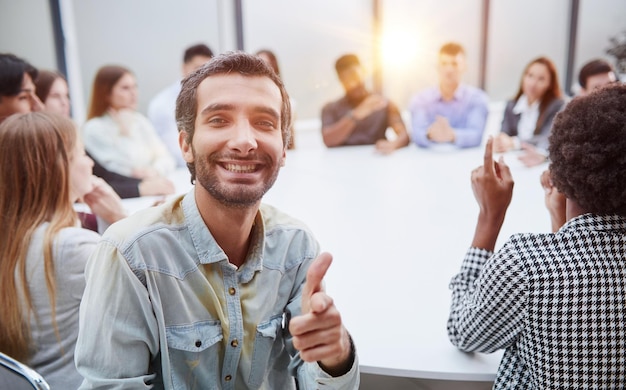 Smiling business group of office workers executive board members or employees looking at camera