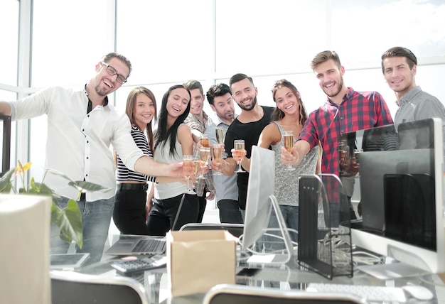 Smiling business team standing in new office