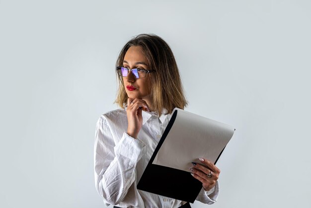 Smiling business woman holding document in clipboard isolated on white background