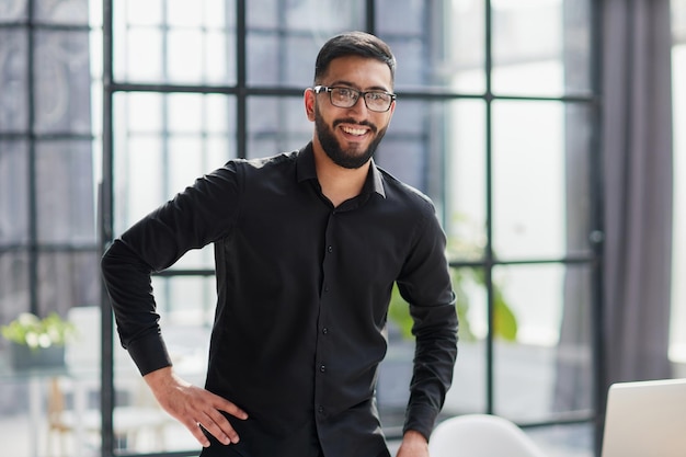 smiling businessman reaching out for a handshake