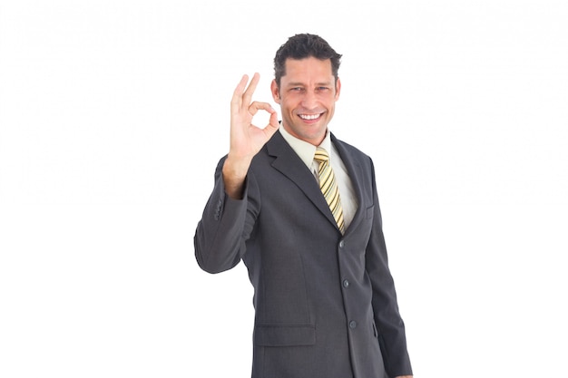 Smiling businessman saying ok