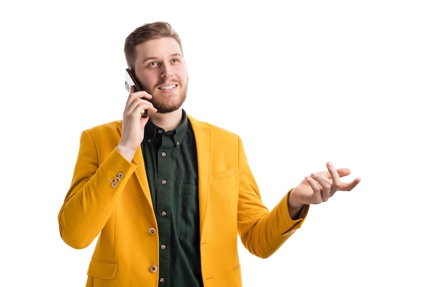 Smiling businessman speaking on smartphone