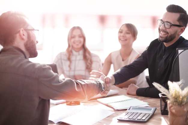 Smiling businessman at a working meeting in the office