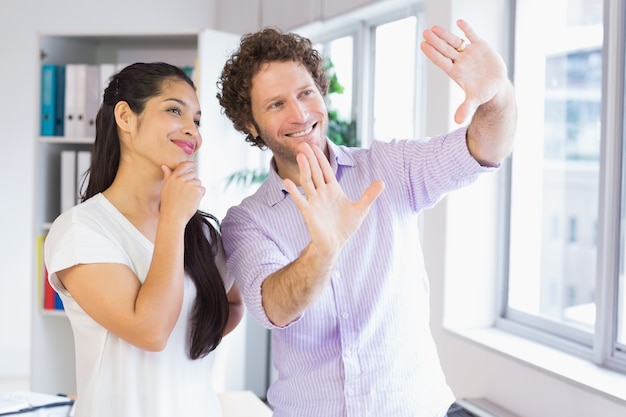 Smiling businesspeople planning in office