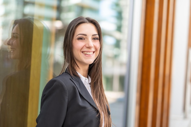 Smiling businesswoman in a city