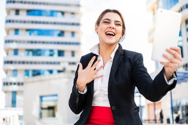 Smiling businesswoman making a video call Young caucasian working girl having an online meeting