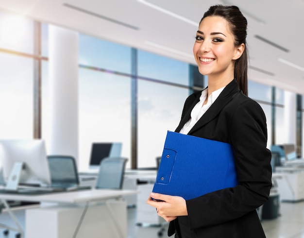 Smiling businesswoman portrait in a modern office