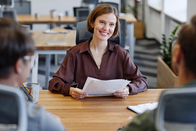 Photo smiling candidate at job interview