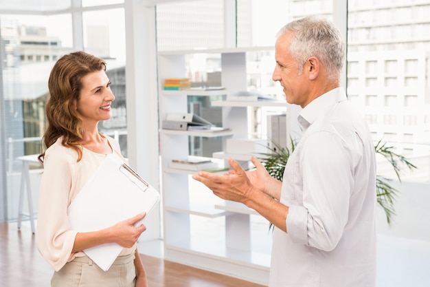 Smiling casual business colleagues talking