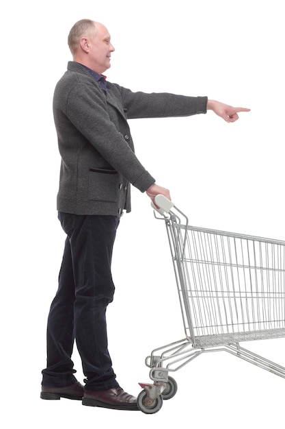 Smiling casual man with shopping cart isolated on a white background