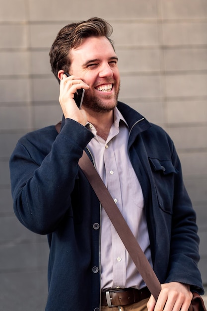 Smiling caucasian businessman talking on the phone