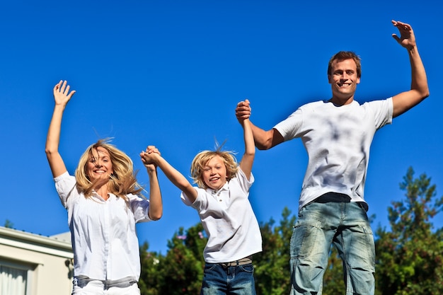 Smiling caucasian Family Playing in the garden 