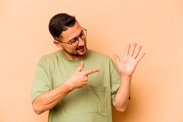 Smiling cheerful showing number five with fingers