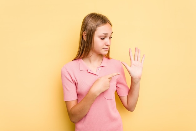 Smiling cheerful showing number five with fingers